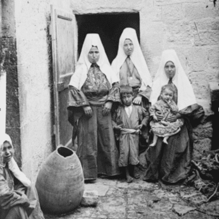 Group of women and children in traditional dress