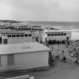 Palestine refugee children outside a prefabricated UNRWA school, Naher el-Bared camp, Lebanon, early 1950s. © Undated UNRWA Archive Photographer Unknown