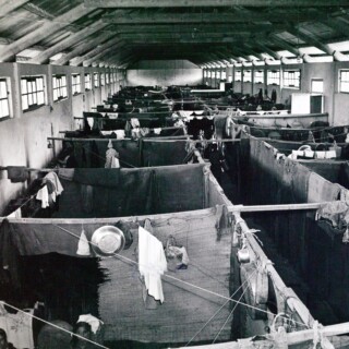 In the Mieh Mieh Palestinian refugee camp in Lebanon in 1952. A barracks room is divided into several compartments to give a semblance of privacy to the families living in the camp. © 1952 UNRWA Archive. Photographer Unknown