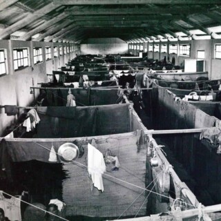 In the Mieh Mieh Palestinian refugee camp in Lebanon in 1952. A barracks room is divided into several compartments to give a semblance of privacy to the families living in the camp. © 1952 UNRWA Archive. Photographer Unknown