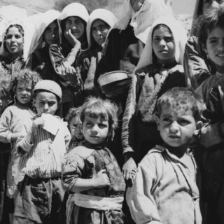 Mothers and children in refugee camp in Jordan, 1955